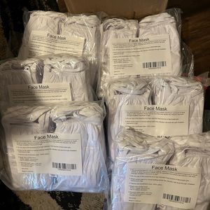New in box white face masks